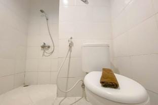 Simple White Accent Studio Paltrow City ByTravelio Apartment in Indonesia