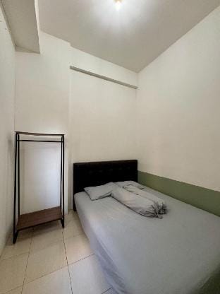 The Darmawan Room at Apartement Puncak Permai Vacation rental in Surabaya