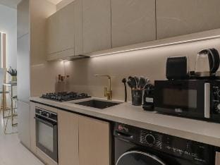 Modern Gold Accents Studio in JVC with Balcony Vacation rental in Dubai