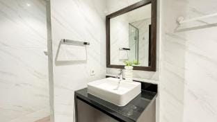 Monochrome Style 1BR at Branz BSD City By Travelio Apartment in West Java
