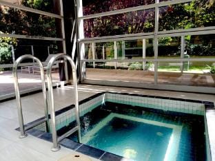 Unwind in Style at Melbournes Historic Art Deco Apartment with Pool Gym Carpark Apartment in Melbourne
