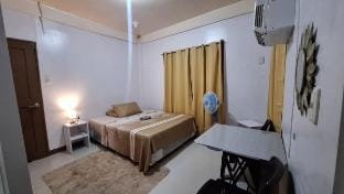 Room near Beach with AC & priv. Bath & kitchen use Vacation rental in Central Visayas