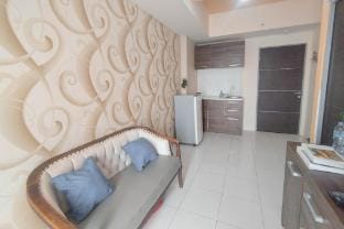 Brown Accent 1BR at Tamansari Prospero By Travelio Apartment in East Java