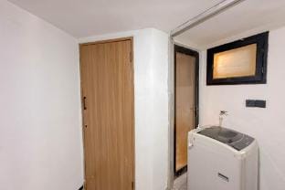 Wooden Accent 3BR Condo Puncak Marina By Travelio Apartment in Surabaya