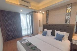 Near Mall 1BR at Grand Sungkono Lagoon By Travelio Apartment in Surabaya