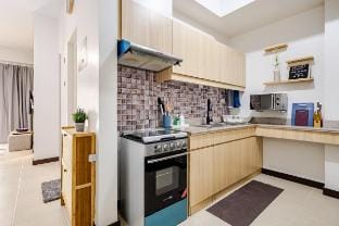 Cozy 2BR Garden View near Airport | WFH & Leisure Apartment in Muntinlupa