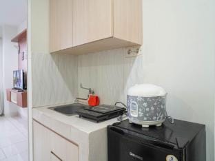 White Compact 1BR at Sentul Tower By Travelio Apartment in West Java