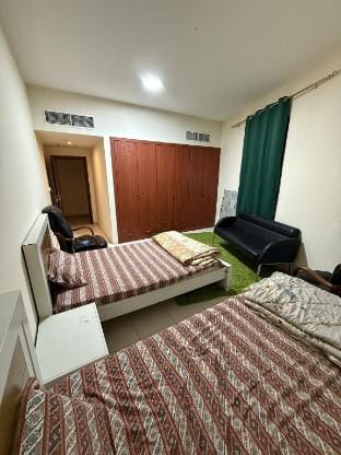 Room with sharing whasroom in ajman rashdiya 1 Vacation rental in Ajman