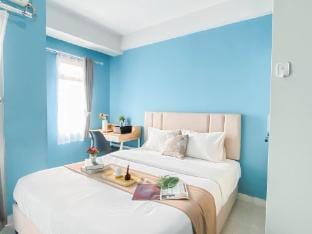 Studio with Blue Tone at Dramaga Tower By Travelio Apartment in West Java