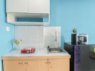 Studio with Blue Tone at Dramaga Tower By Travelio Apartment in West Java