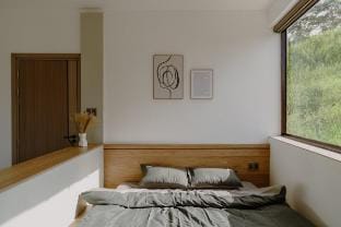 The room has a view of the house and pine hill Vacation rental in Dalat
