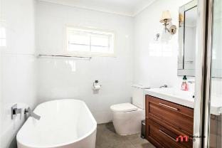 MetaWiseBnB | Waterfront 3BR Coastal Escape Vacation rental in Deception Bay