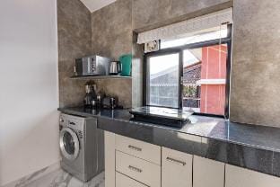 Modern 1BHK Condo | W/S. Pool | 3m. Walk To Beach Apartment in Goa, India