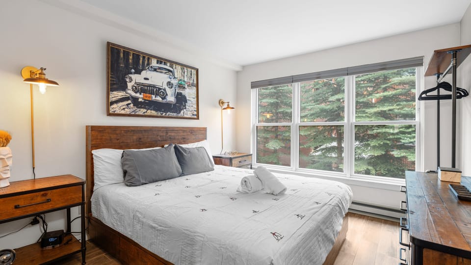 The bedroom features a California king bed.