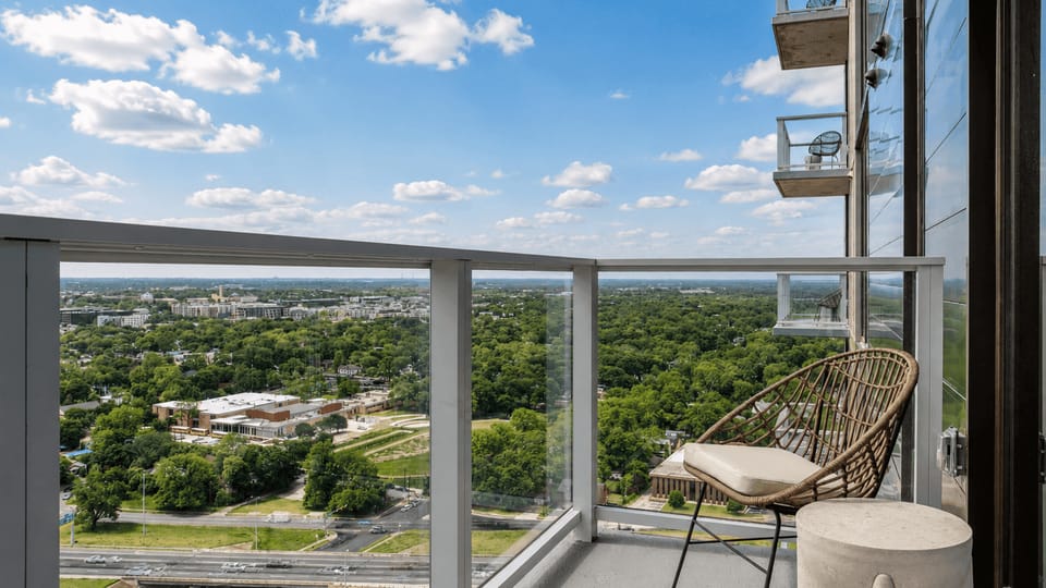 Balcony with seating and expansive views.