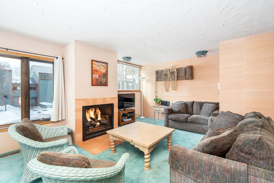 Cosy living area with a fireplace to keep you warm.