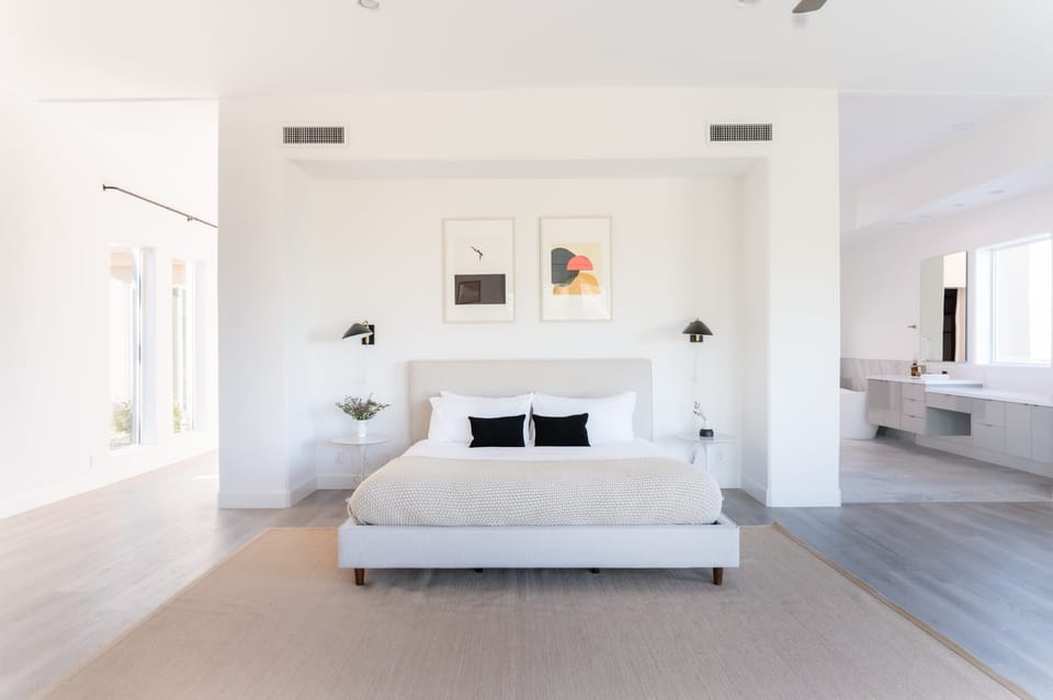 Master bedroom features a king bed.