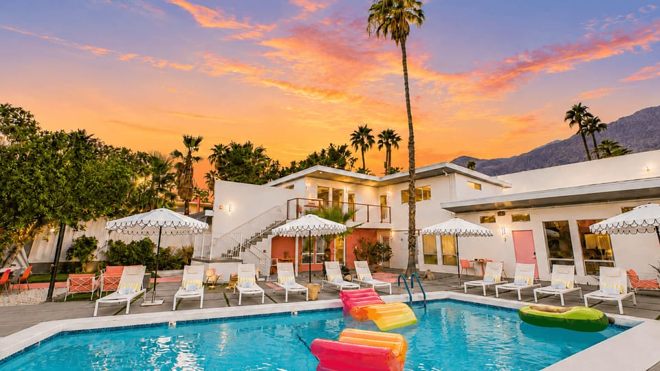 Twilight poolside vibes with glowing skies, colorful floats, and plenty of space to unwind.