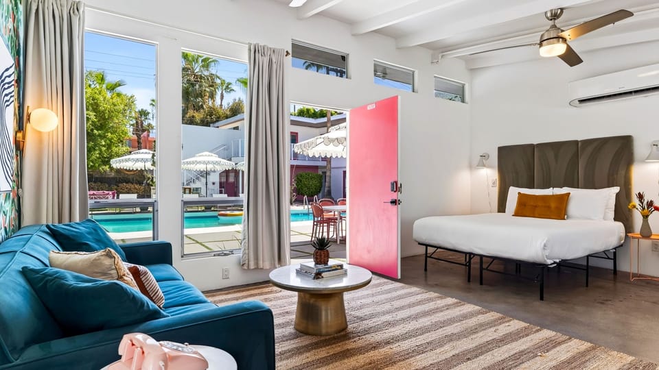 Wake up just steps from the pool in this bright studio-style retreat, with a plush bed, cozy lounge seating, and direct patio access.