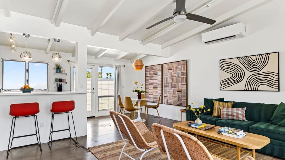 Bright, modern interiors pair a comfortable lounge with breakfast-bar seating and a sunny dining nook for easy everyday gathering.