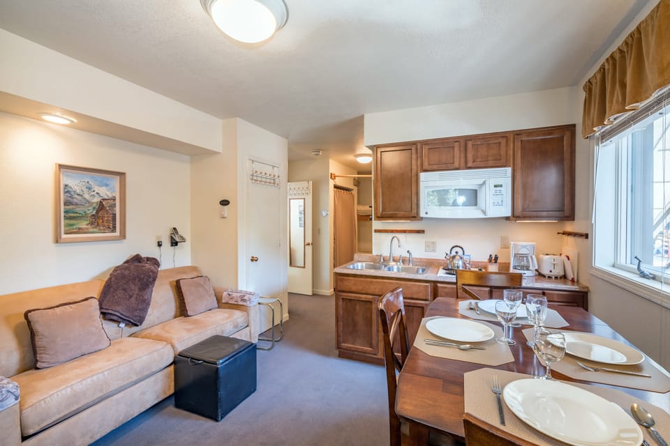 Living room features a queen sleeper sofa.