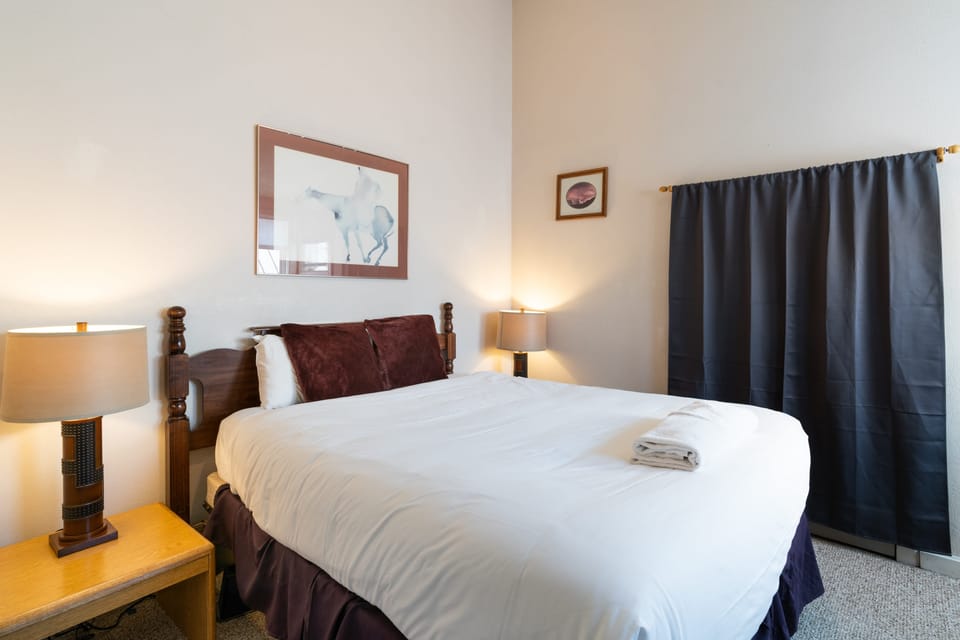 Two main bedrooms, each with a queen bed.