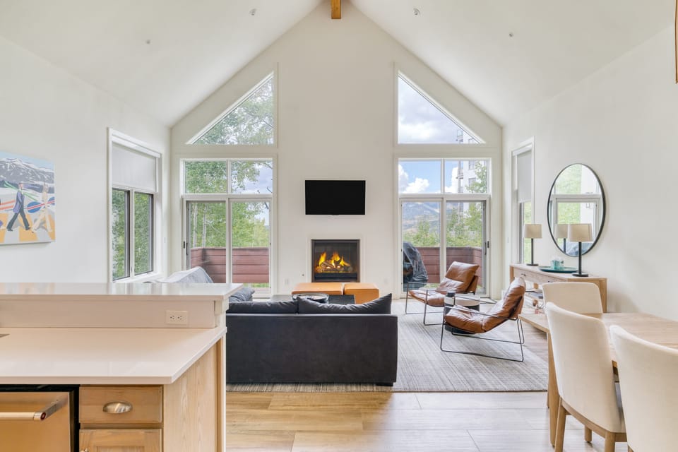 Primary bedroom features a king bed, TV, and views.