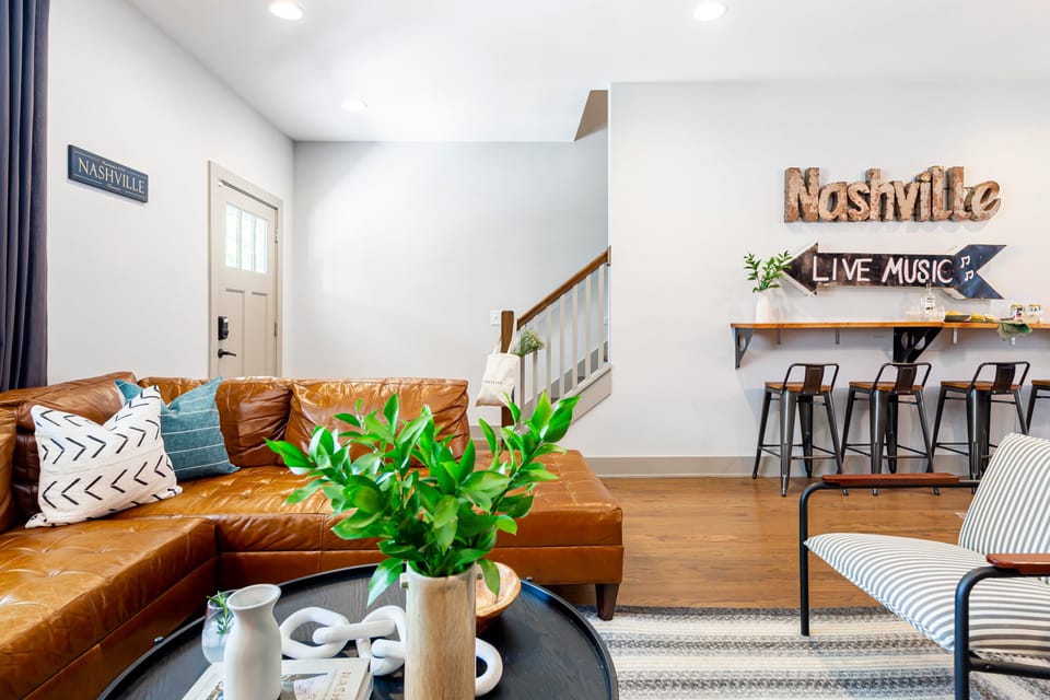Living area features locally inspired decor.
