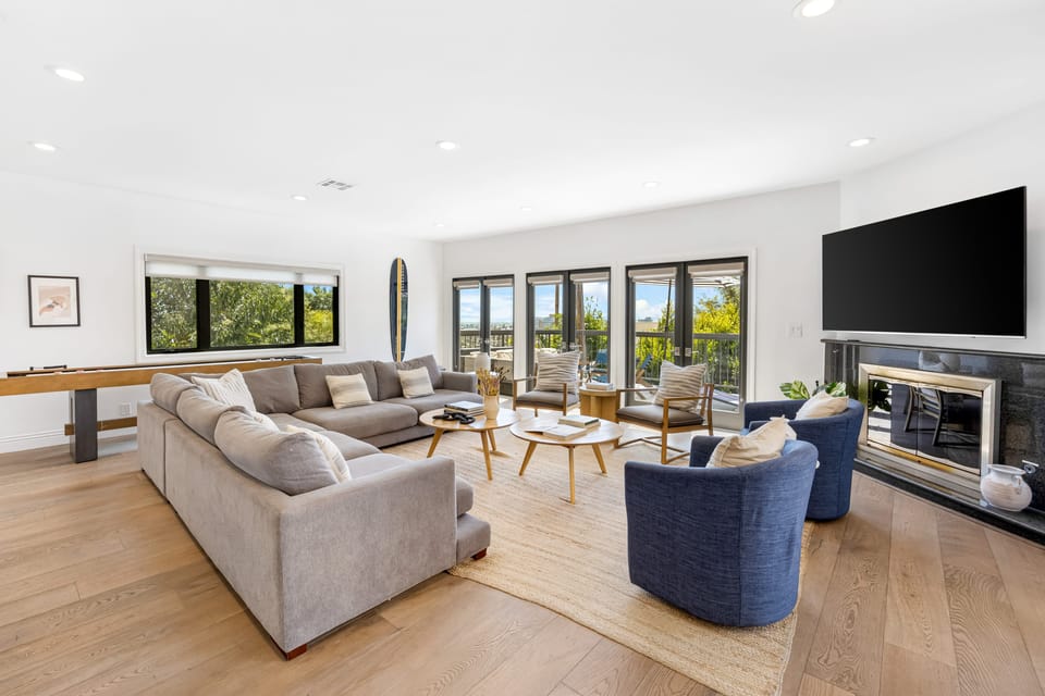 Bright and inviting living room with fireplace.