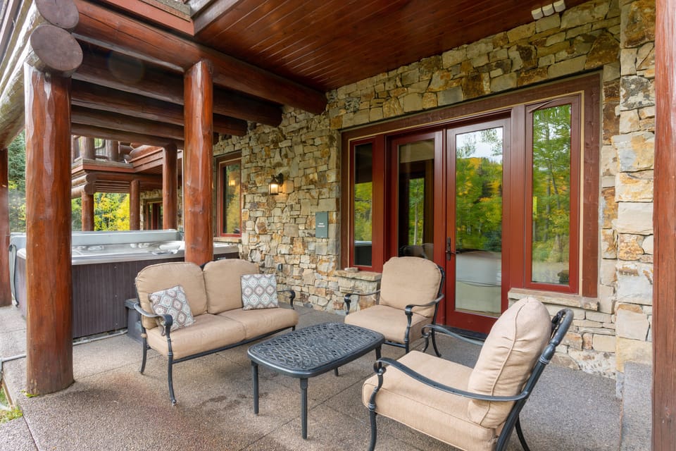 Patio and lounge area near the hot tub.