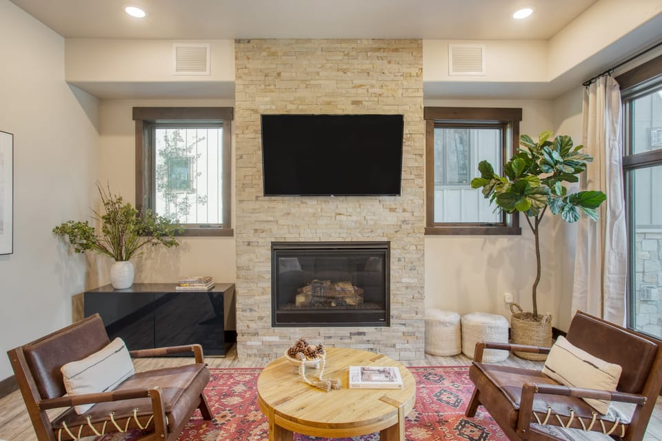 Living room features a fireplace and TV.