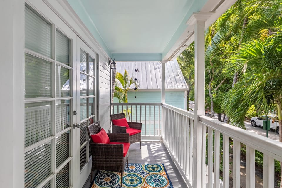 Relax on the front balcony located off the primary bedroom.
