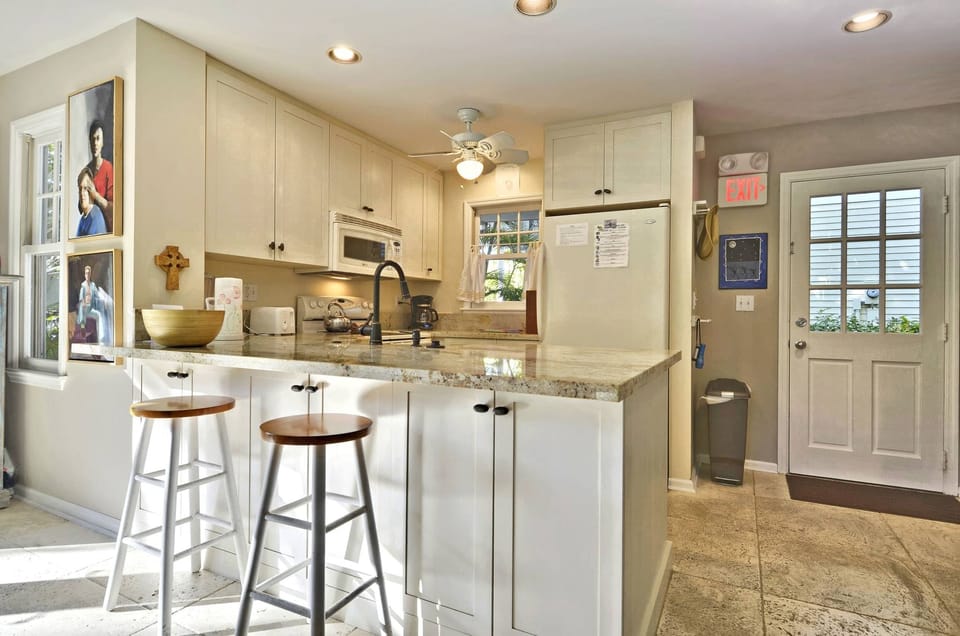 Kitchen features a breakfast bar.