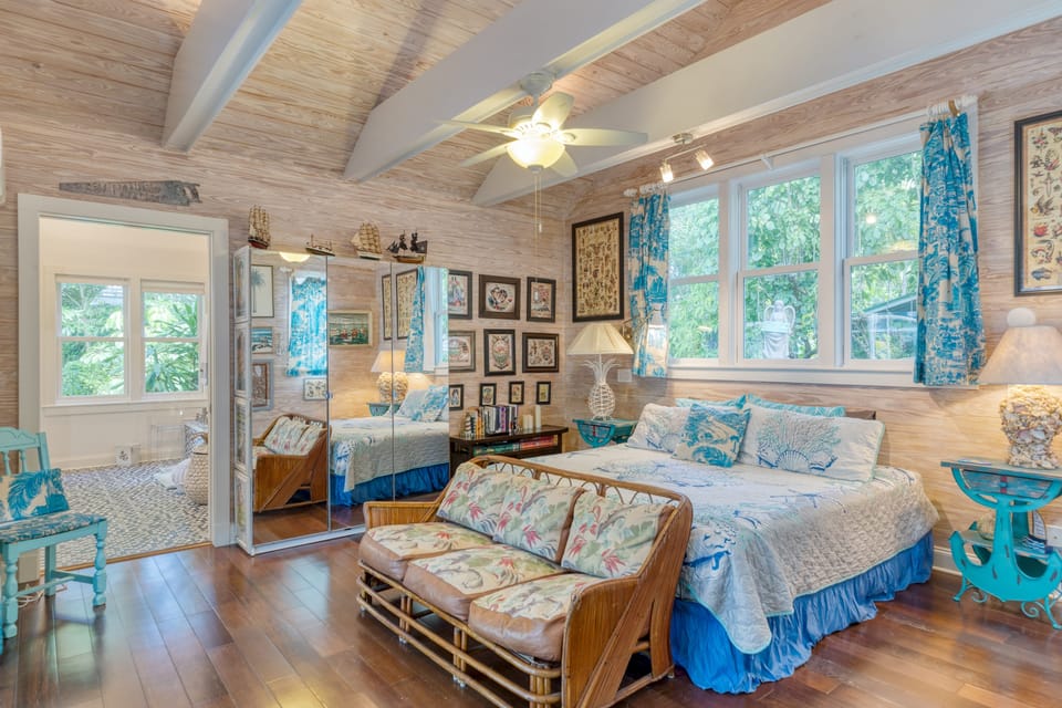 Bedroom features a king bed and TV.