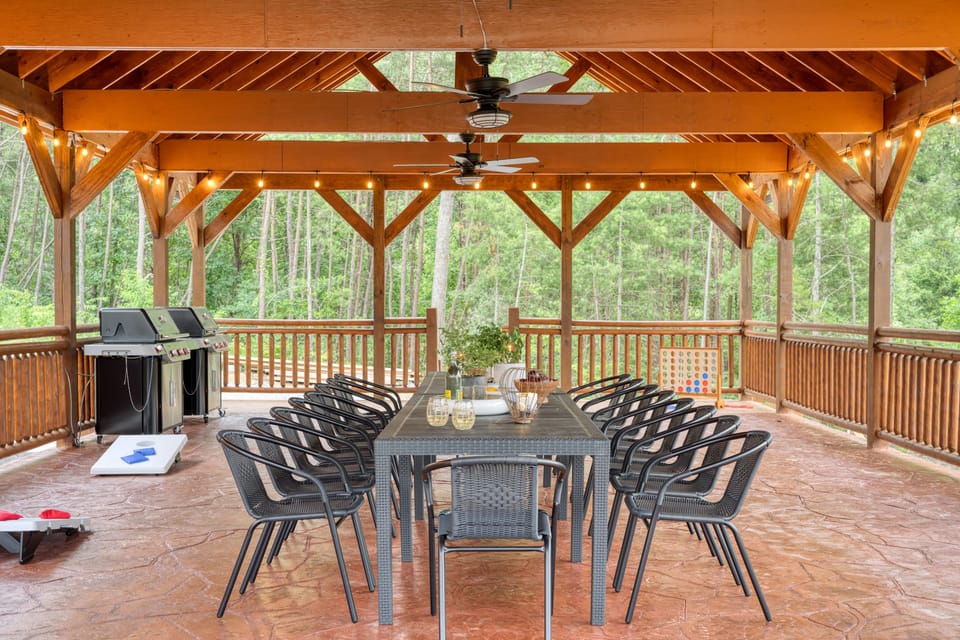 The huge outdoor pavilion is perfect for hosting events, with a table that sits 10, a grill, and lighting for when the sun goes down.
