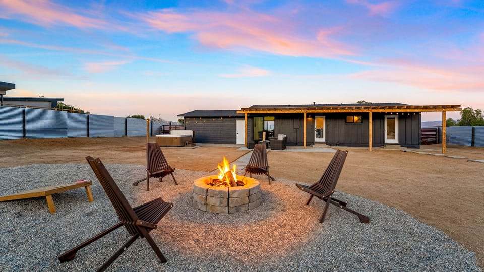 End the day with fireside conversations beneath a colorful desert sunset, with the hot tub waiting nearby.