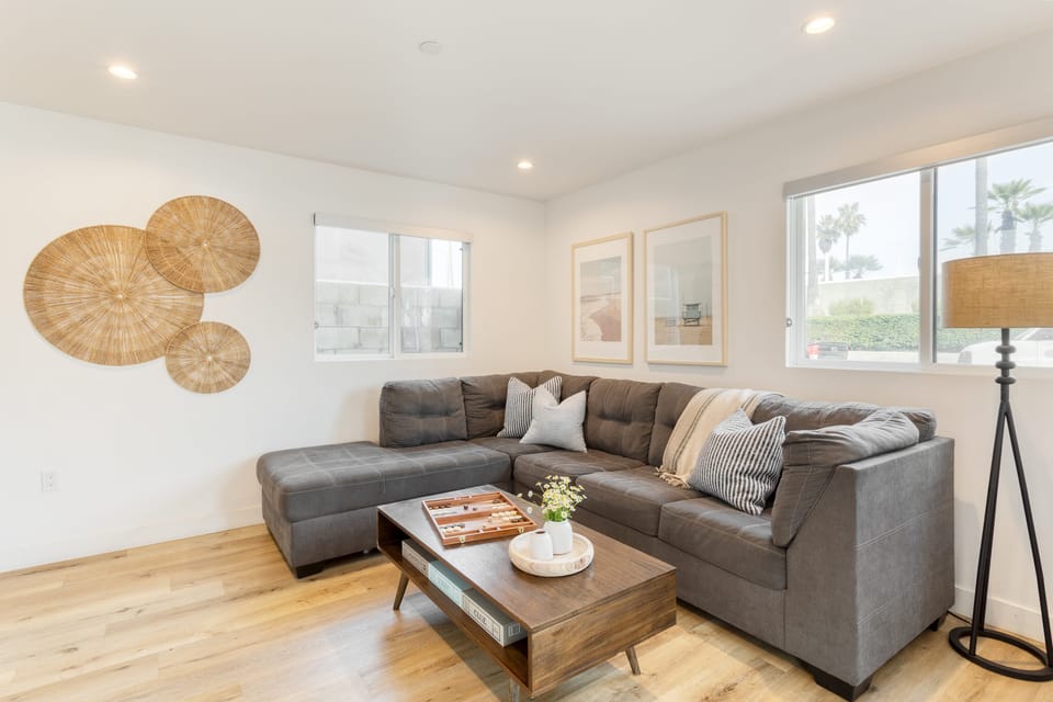 Living room features a full-size sleep sofa.