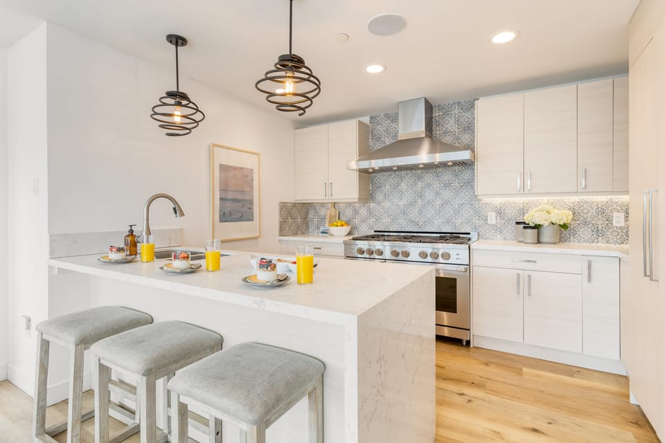 Each space features a kitchen.