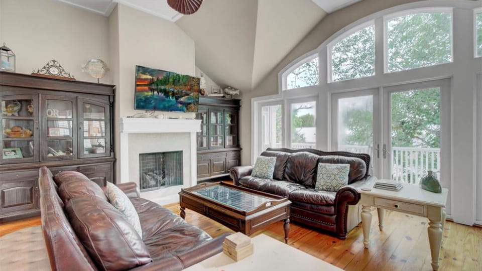 Gorgeous living area with windows galore.