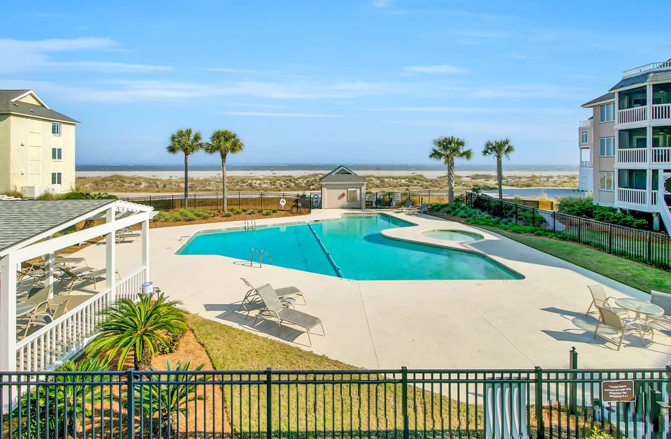Communal pool with beach views.