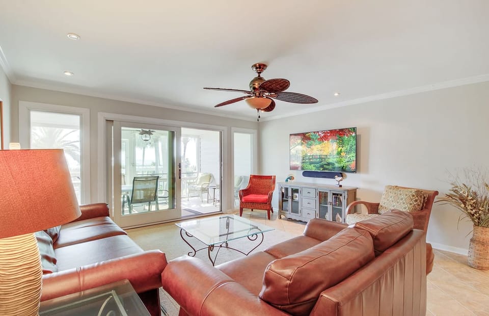 Comfortable living area with balcony access.