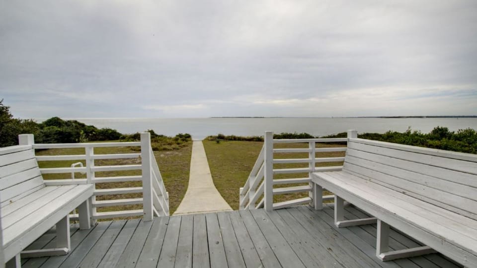 Open deck with beach path.