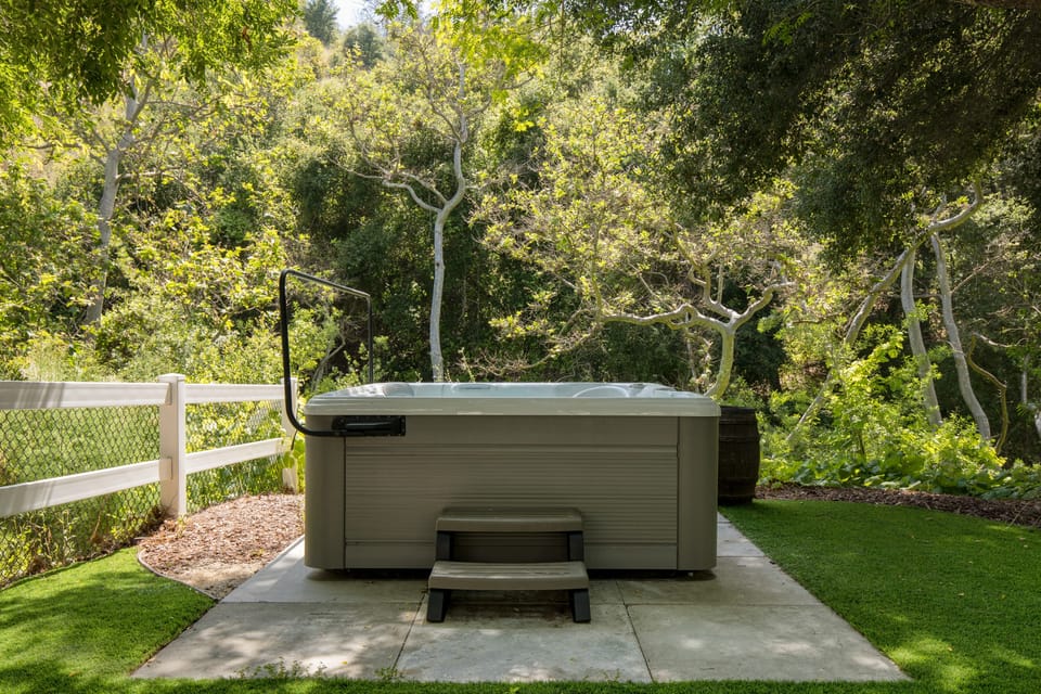 Hot tub for soaking with a glass of local wine.