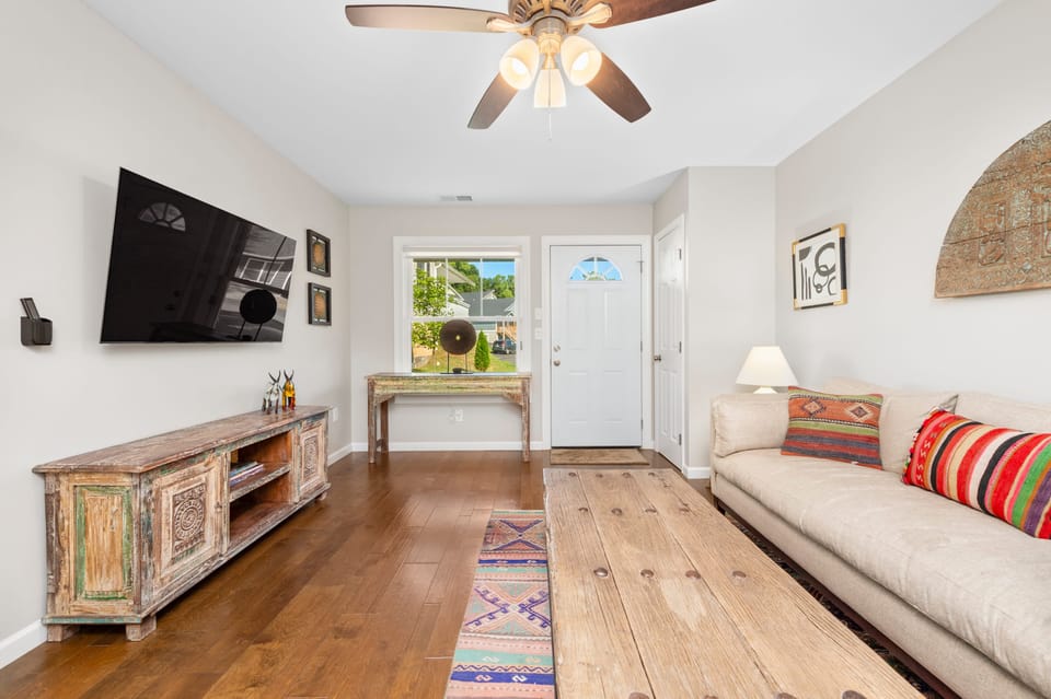 Comfortable living room with a sofa and TV.