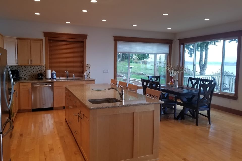 Where the kitchen island and dining area unite for culinary bliss.