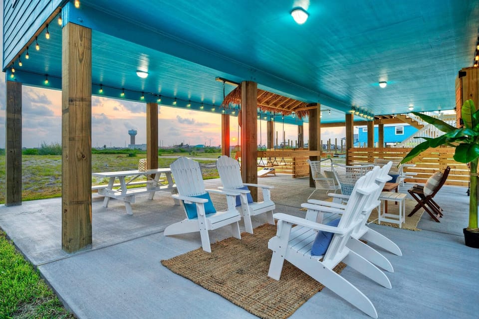 Adirondack chairs adorned the outdoor living space.
