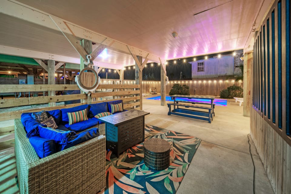 Relaxation meets luxury with this inviting couch by the pool.