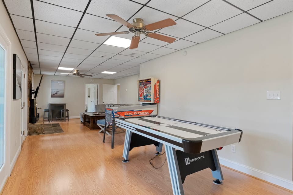 Lower Level game area. Smash, score, repeat – that's the air hockey way.