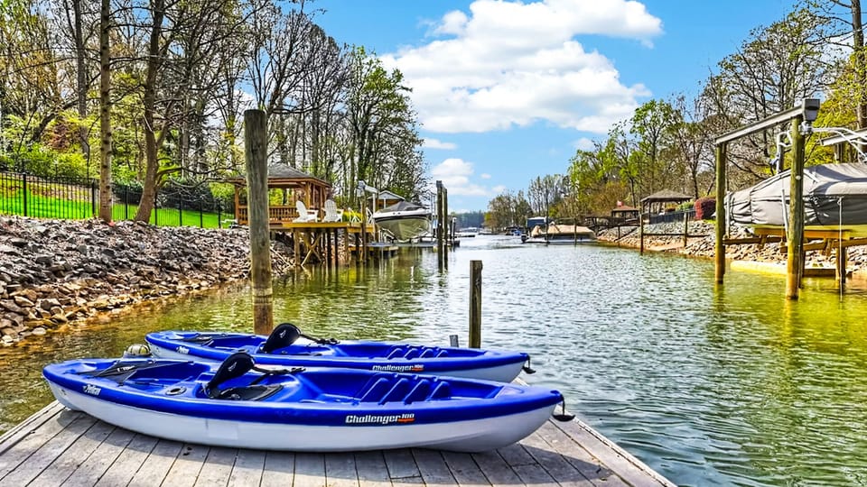Private dock access with complimentary kayaks, perfect for exploring the peaceful lake coves and soaking in the waterfront views.