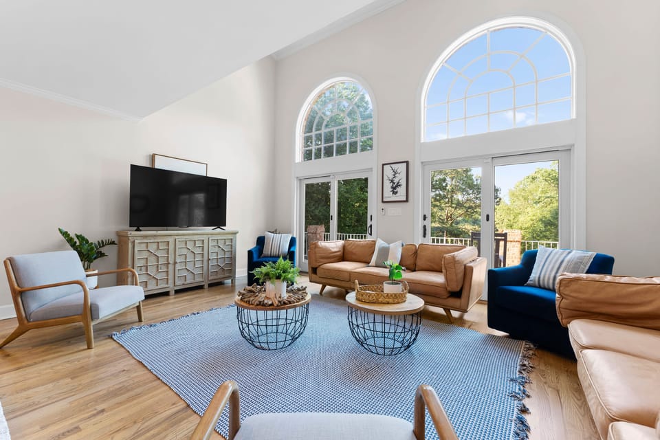 Fully equipped kitchen with a gas range and barstool seating.